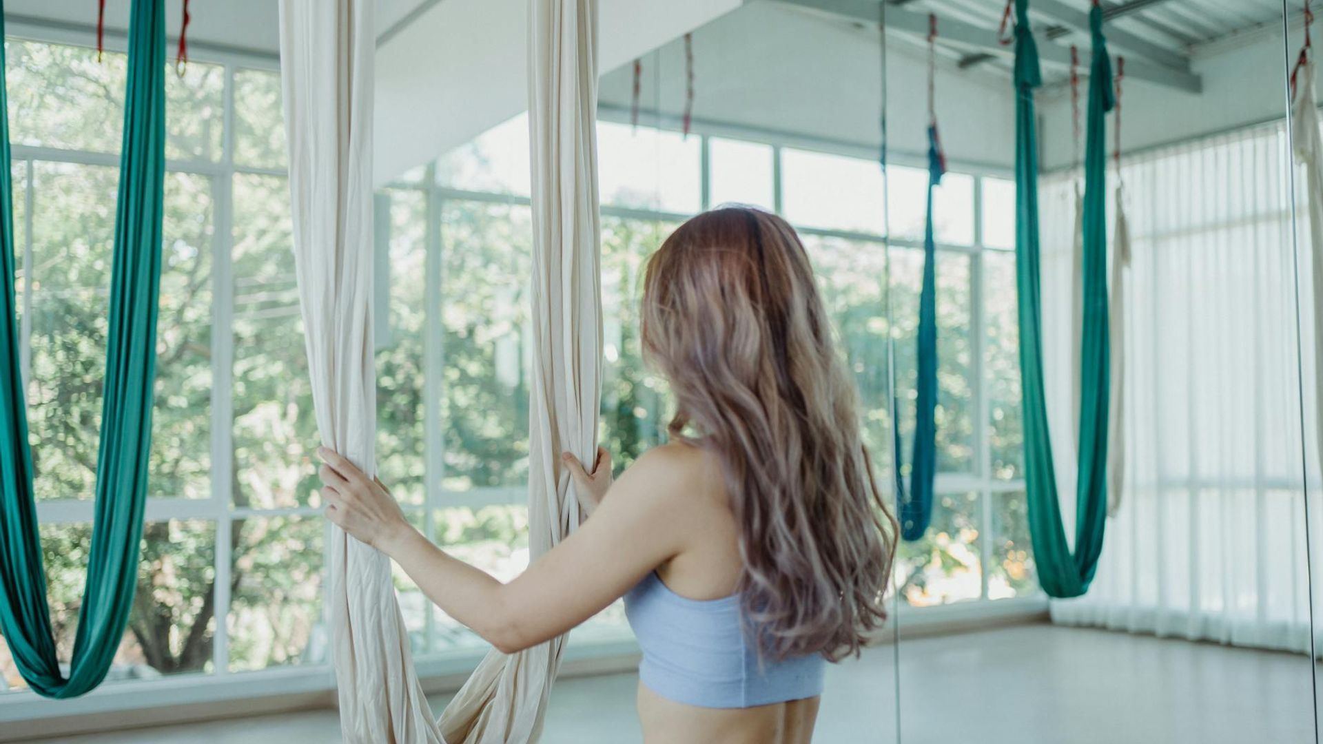 Serene yoga atmosphere with soft purple lighting in a modern studio
